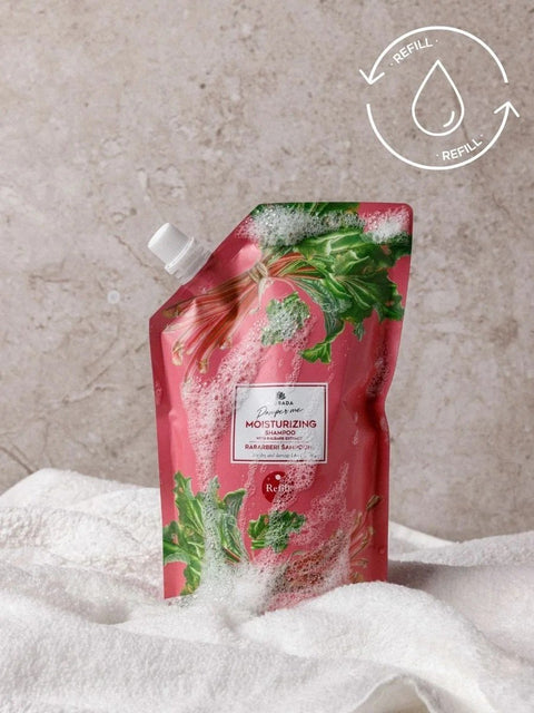 1. Magrada Organic Cosmetics rhubarb shampoo refill pack on white towel, showcasing eco-friendly design