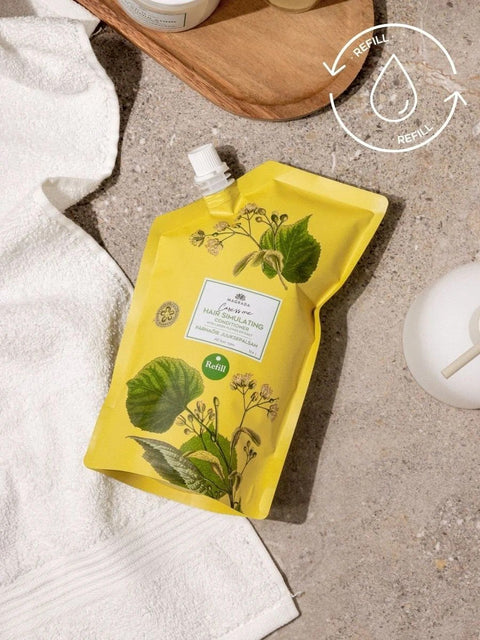 1. Magrada Organic Cosmetics linden flower conditioner refill pack on bathroom counter, showcasing eco-friendly packaging