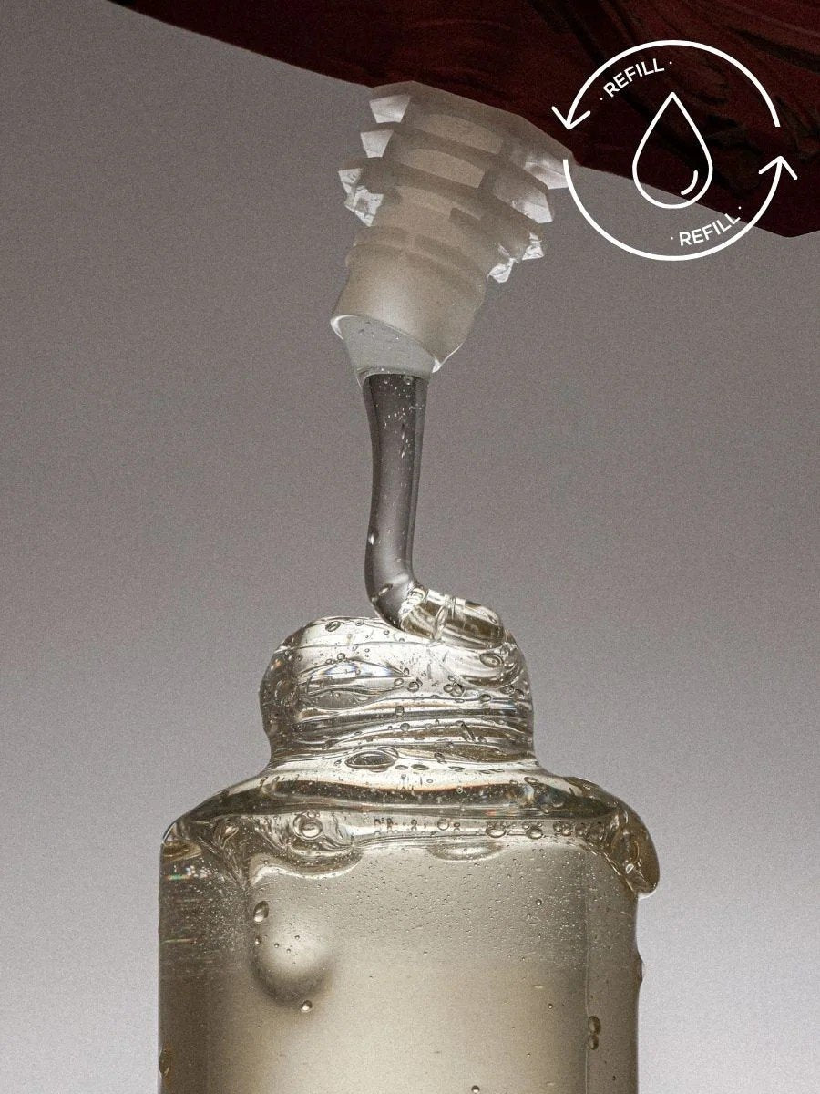 3. Close-up of Magrada Organic Cosmetics Linden Flower Shampoo being poured from refill pack