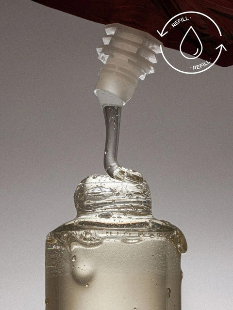 3. Close-up of Magrada Organic Cosmetics Linden Flower Shampoo being poured from refill pack