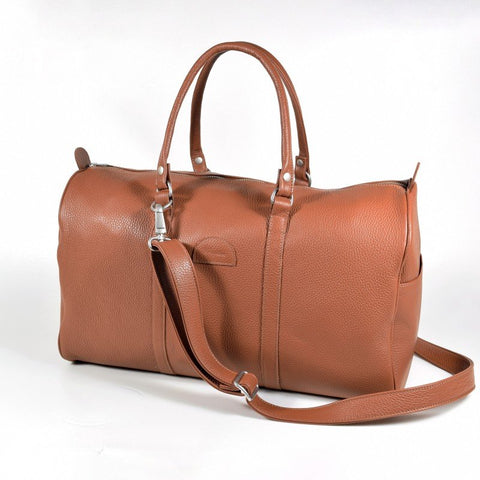 1. Papillon light brown leather travel bag 20L with detachable shoulder strap, shown in studio setting