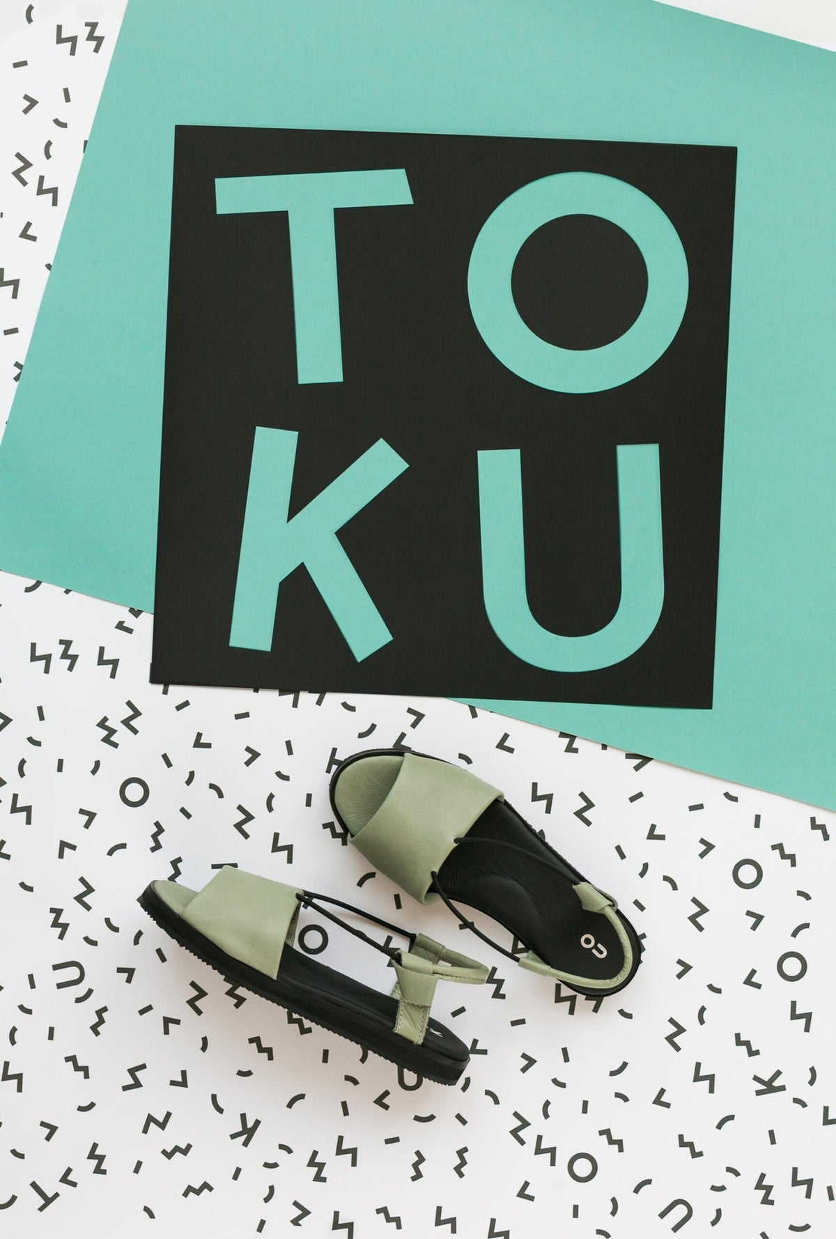 4. Flat lay of green Berlin sandals by Omaking with black insole, showcasing the ergonomic design