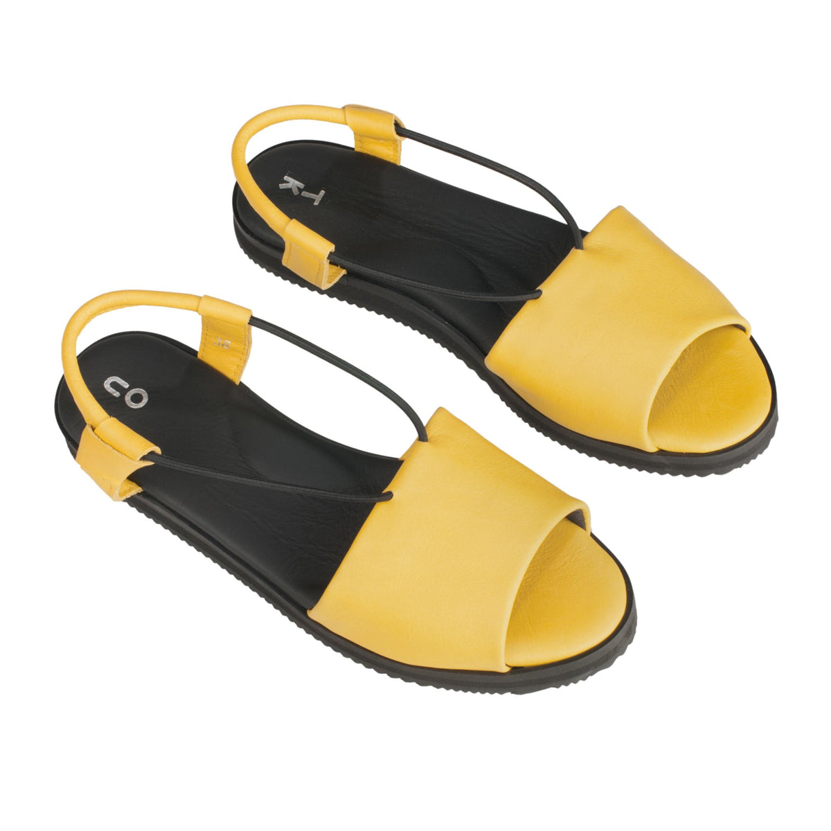 4. Studio shot of yellow Berlin sandals by Omaking, showing ergonomic design and leather upper