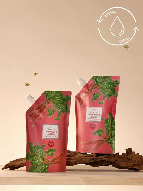 3. Two Magrada Organic Cosmetics rhubarb hair mask refills on wooden surface, eco-friendly design