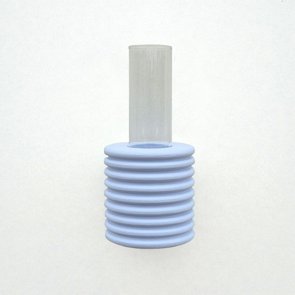2. Studio shot of Ribble Wall Vase in light blue, highlighting ribbed beech wood and glass tube