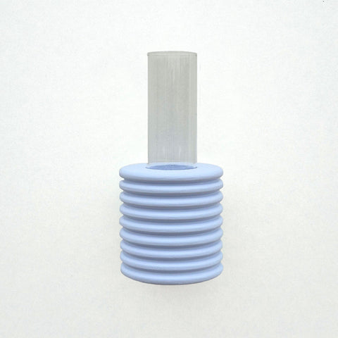 2. Studio shot of Ribble Wall Vase in light blue, highlighting ribbed beech wood and glass tube