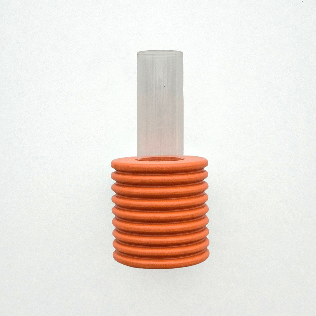 5. Studio image of Ribble Wall Vase in orange, showing beech wood texture and tube vase