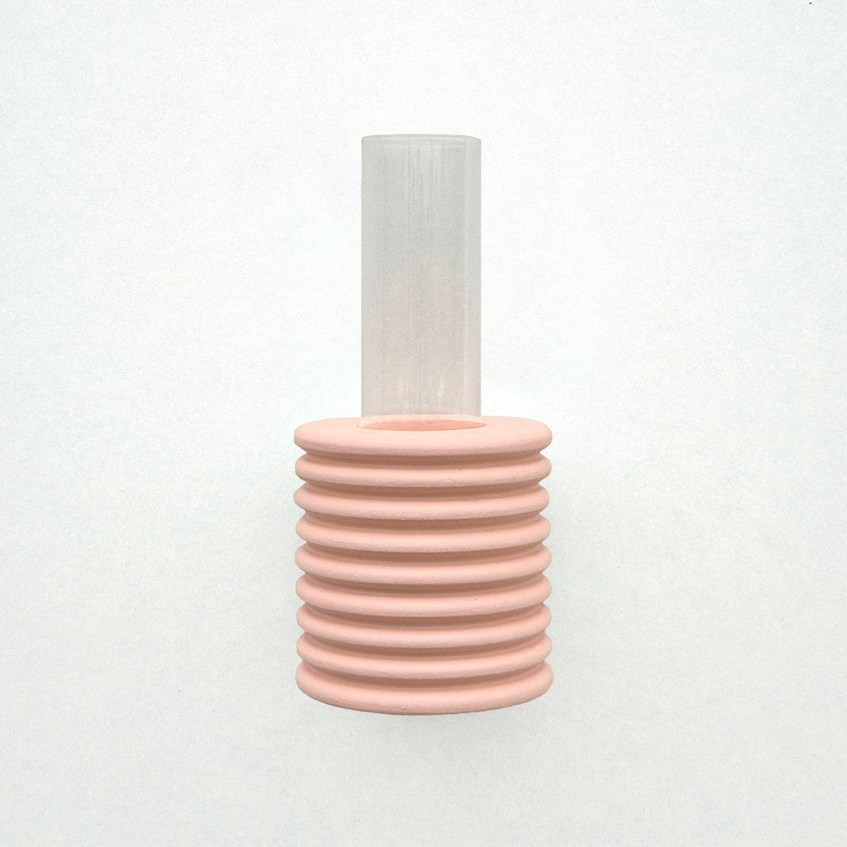 2. Studio shot of Ribble Wall Vase in pink by 5mm Paper, highlighting ribbed design and clear tube