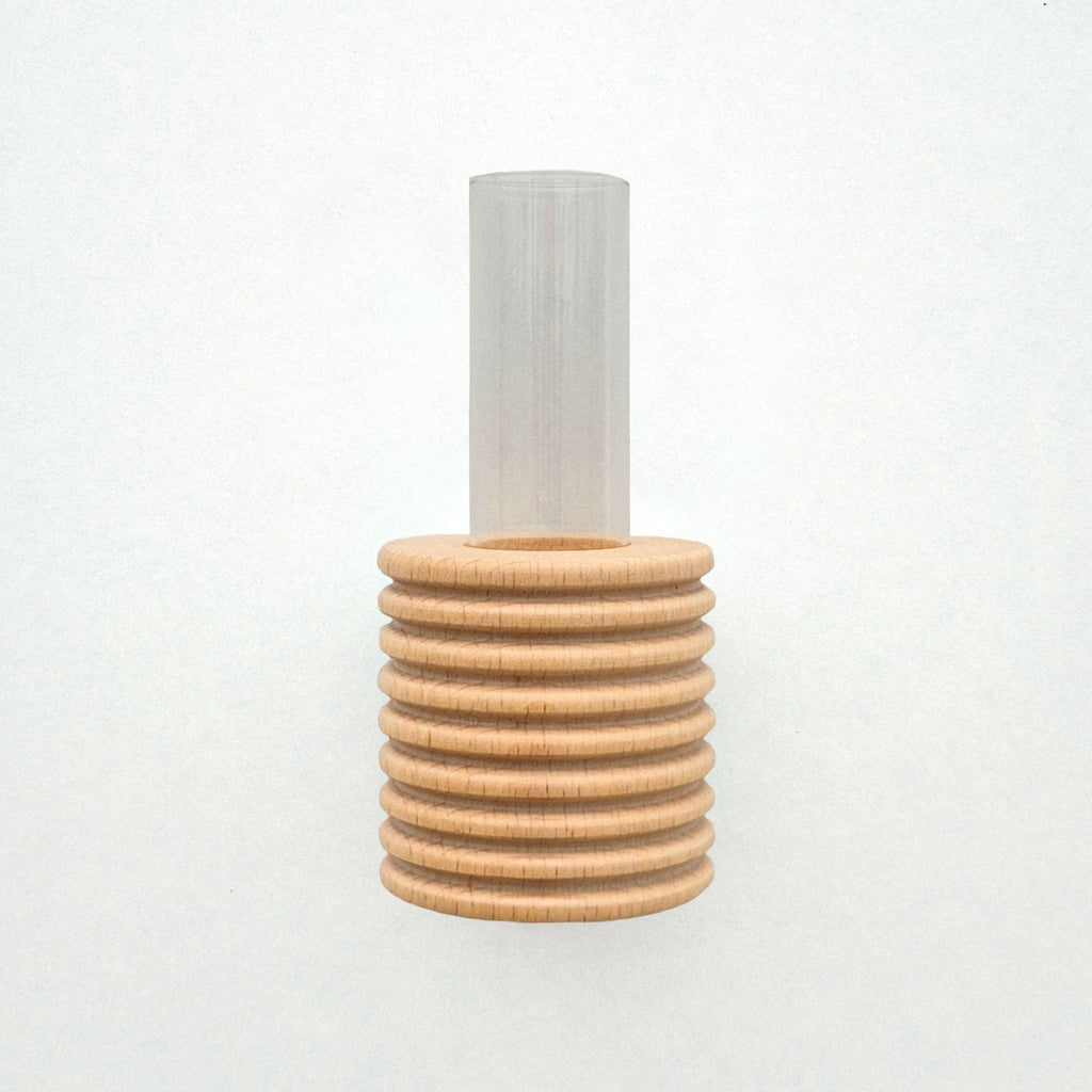 2. Studio shot of Ribble Wall Vase by 5mm Paper, featuring beech wood with blue paint and clear tube