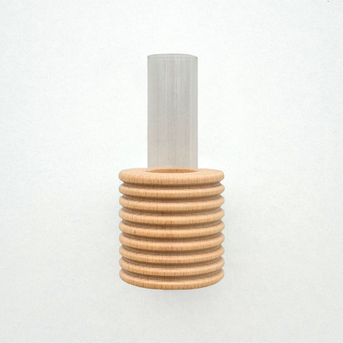 2. Studio shot of Ribble Wall Vase by 5mm Paper, featuring beech wood with blue paint and clear tube