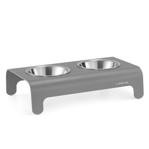 2. Grey Labbvenn Rico pet feeder with two stainless steel bowls on a sleek aluminum base, shown in studio setting