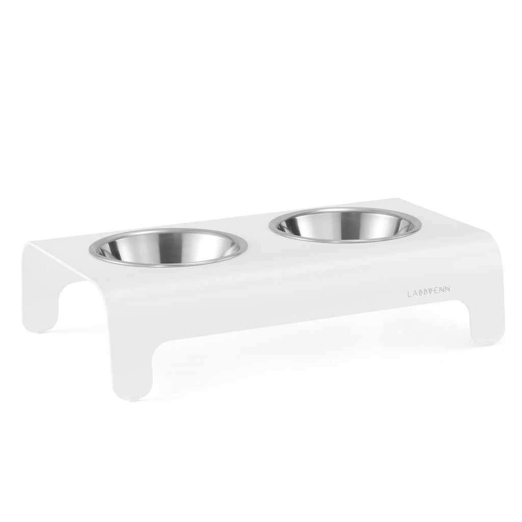 2. White Rico pet feeder with two stainless steel bowls on clean white background, Labbvenn logo visible