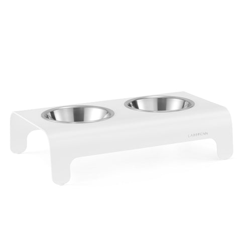 2. White Rico pet feeder with two stainless steel bowls on clean white background, Labbvenn logo visible