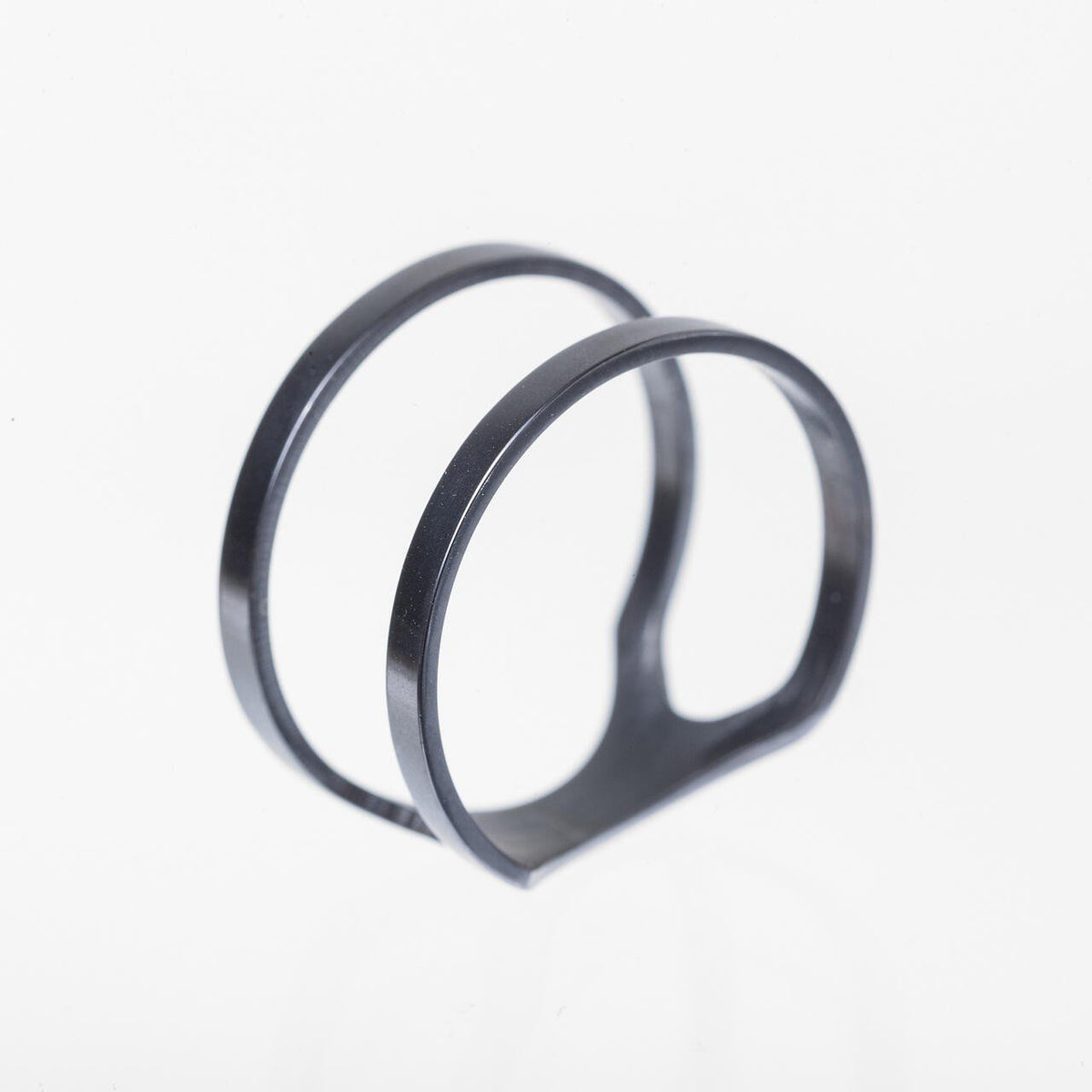 3. Close-up of stainless steel ring with dual band design and polished finish