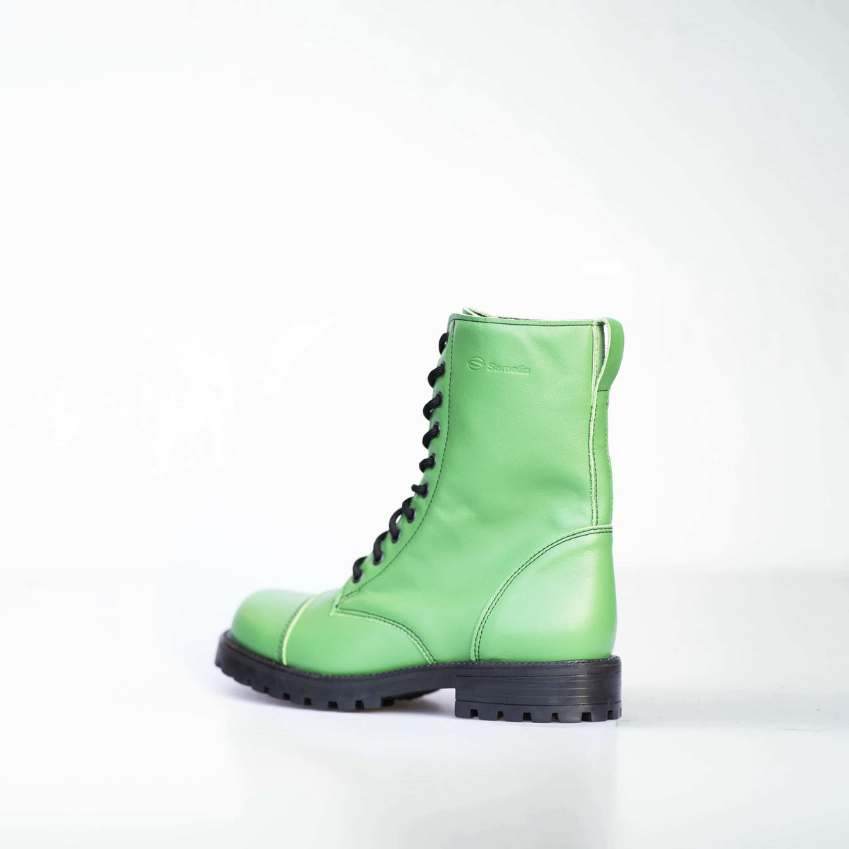 2. Side view of unisex Samelin 511 Granny Smith boots in green leather, studio shot