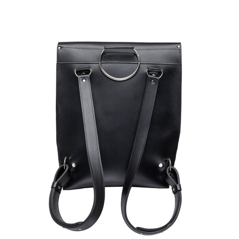 3. Studio shot of PYKOK Backpack Romeo in black leather, showing adjustable shoulder straps and metal ring detail