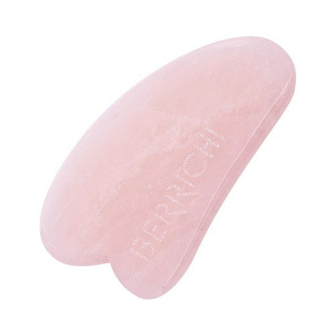 1. Berrichi Rose Quartz Gua Sha Massage Crystal in studio setting, highlighting smooth pink surface and engraved branding