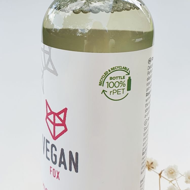 7. Close-up of Vegan Fox Rose Micellar Water bottle, highlighting 100% recycled plastic packaging