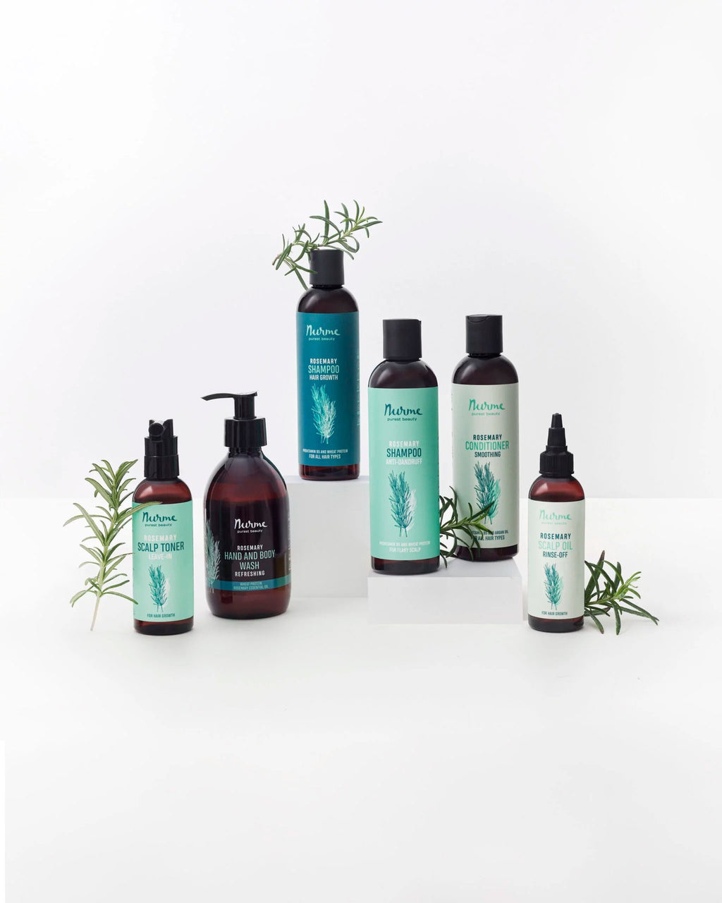 1. Collection of Nurme products including rosemary hand and body wash, scalp toner, and shampoo, arranged with rosemary sprigs on white background