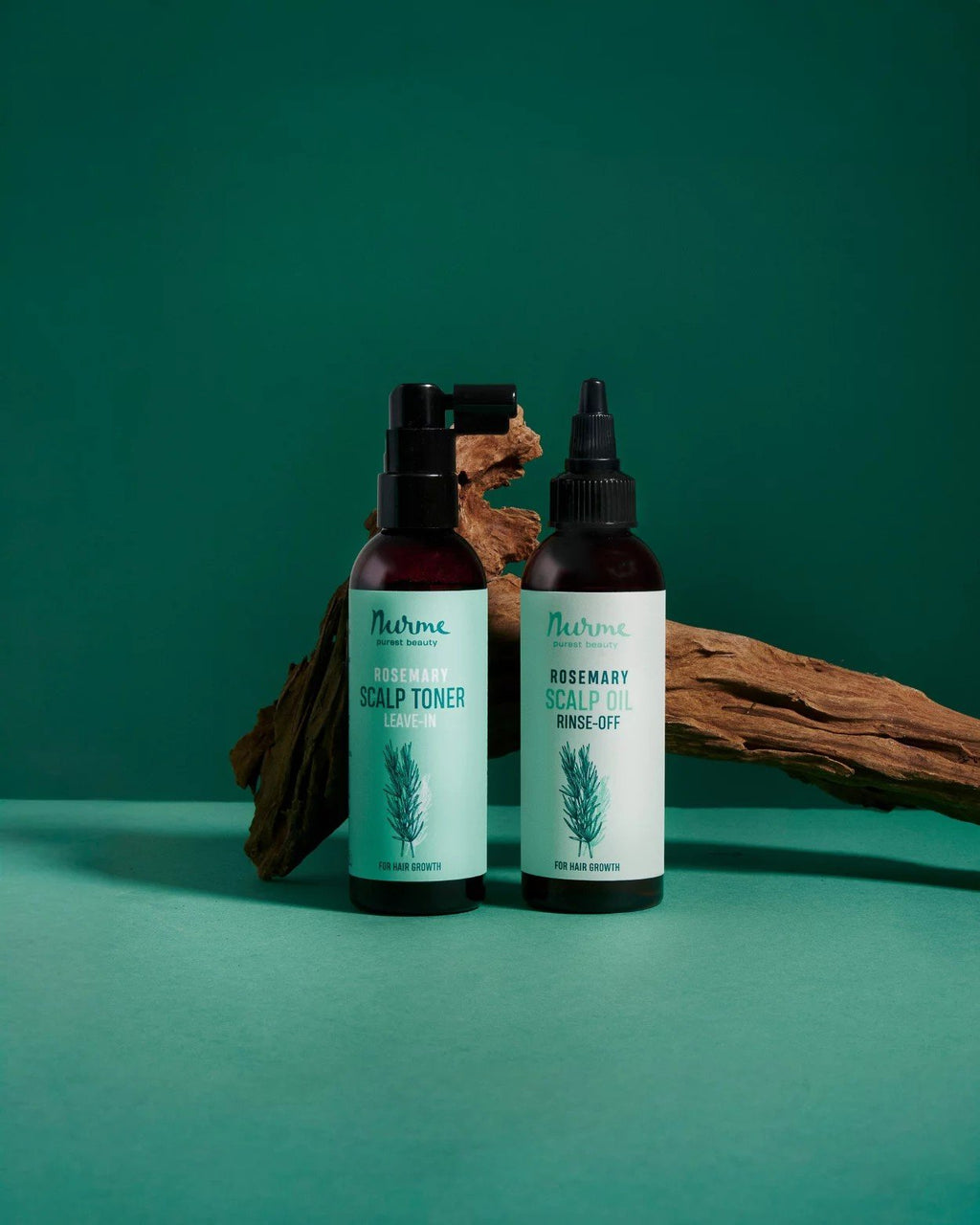 1. Nurme rosemary scalp toner and oil bottles on green background with wooden accents