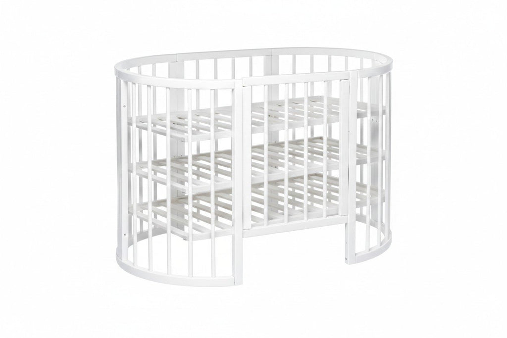10. White round baby crib with slatted base, shown with mattress removed
