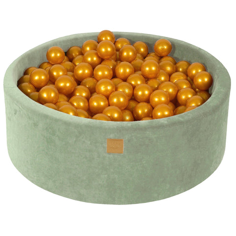 1. Sage velvet round ball pit filled with 200 golden balls, featuring a soft hypoallergenic foam structure, ideal for children's play and sensory integration therapy.