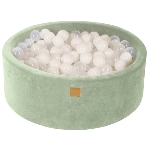 1. Sage velvet round ball pit filled with 200 white and transparent balls, featuring a soft hypoallergenic foam structure, ideal for children's play and sensory development.