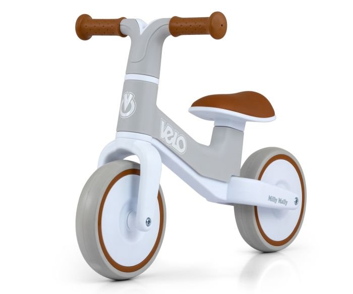 2. Milly Mally VELO balance bike with grey frame and brown accents, featuring non-slip grips and EVA wheels, shown in studio setting