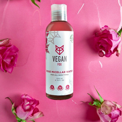 4. Vegan Fox Rose Micellar Water bottle on pink background with roses, emphasizing floral essence