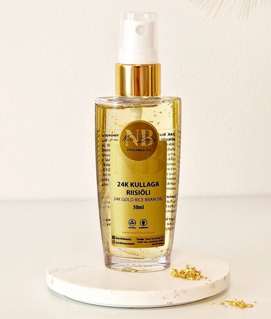 3. North Beauty 24K Gold Rice Oil 50ml on marble surface with gold flakes, highlighting luxury