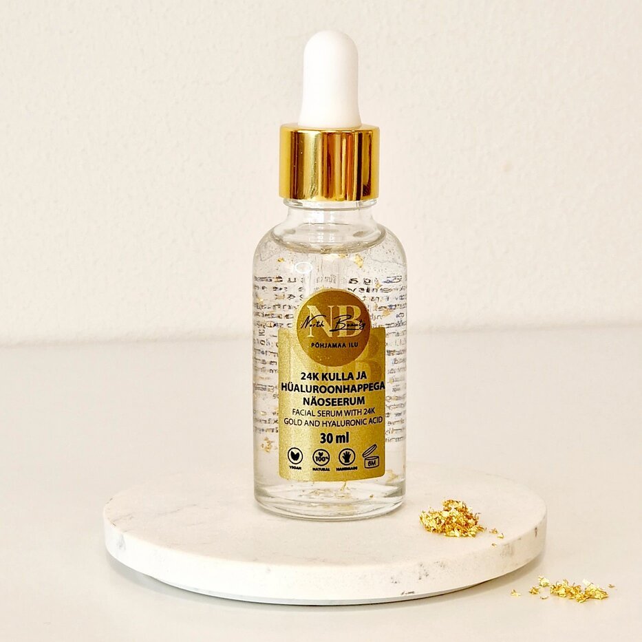 4. North Beauty 24K Gold and Hyaluronic Acid Face Serum, 30ml, on marble surface with gold flakes