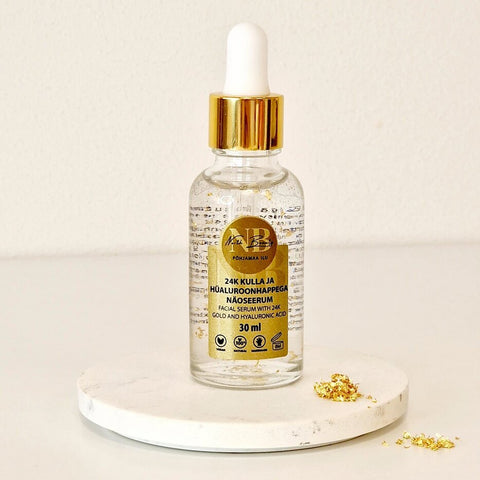 4. North Beauty 24K Gold and Hyaluronic Acid Face Serum, 30ml, on marble surface with gold flakes