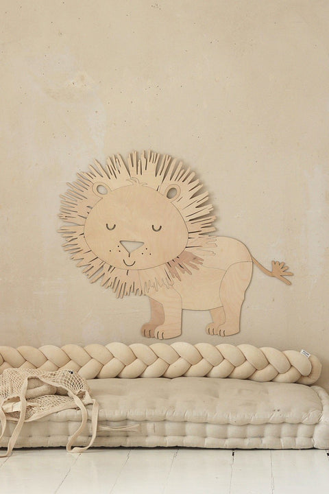 1. Wooden lion wall decoration in a cozy room with beige braided cushion and woven basket