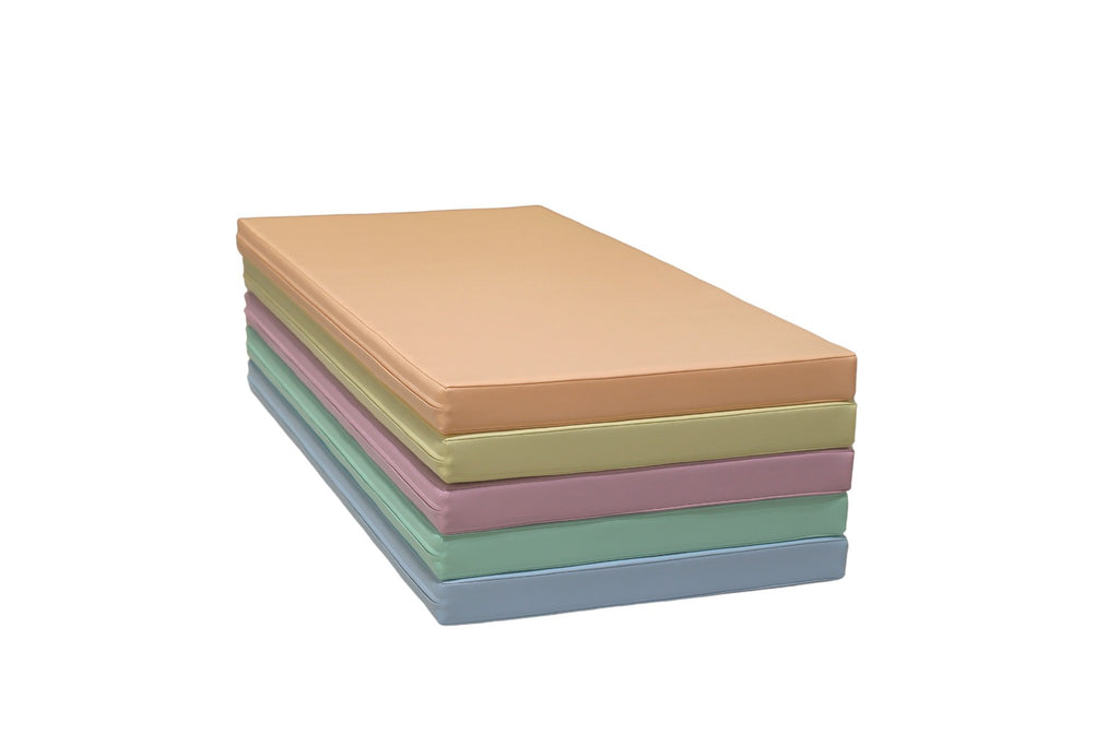 10. Stack of five pastel mats, showcasing thickness and color variety for diverse play options
