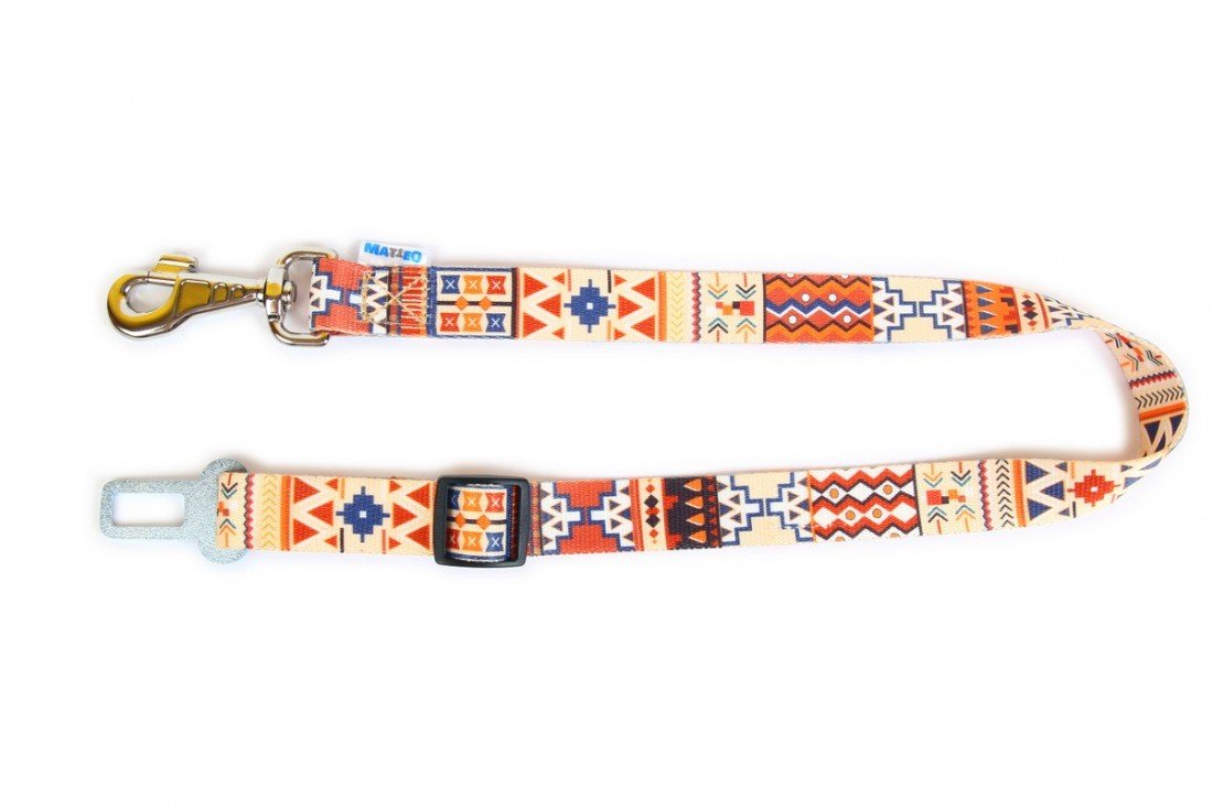 2. Studio shot of Matteo boho safety belt for dogs with colorful geometric pattern, metal clip, and buckle attachment on white background