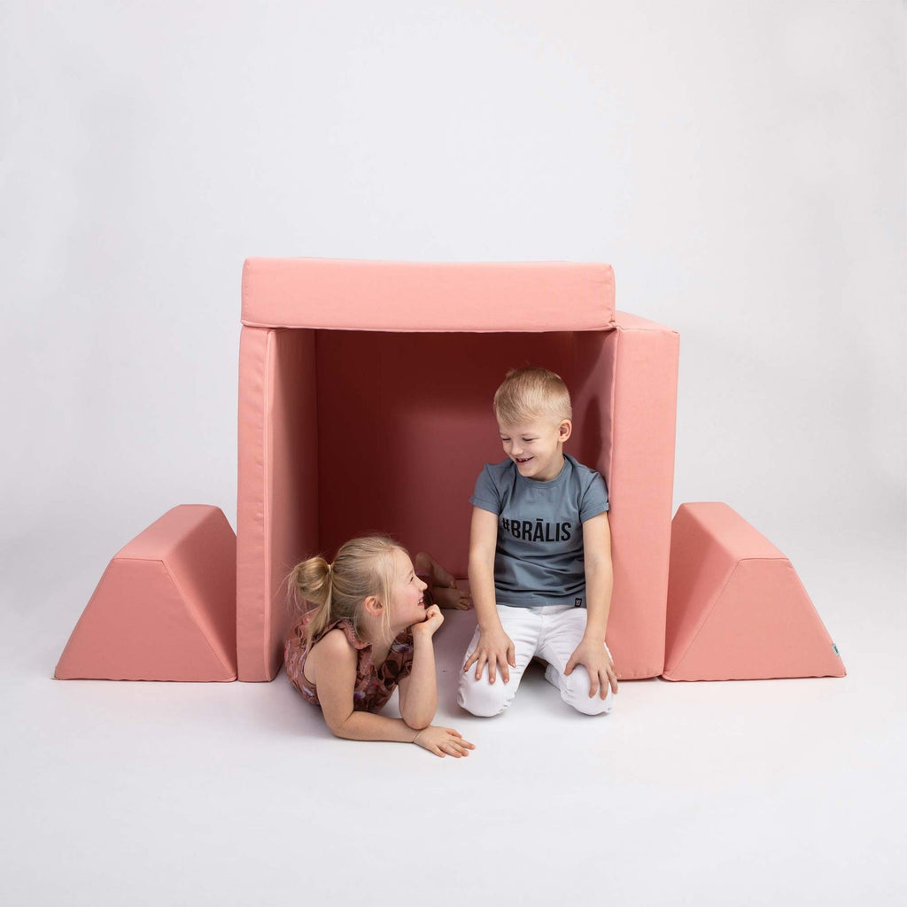 4. Two children playing inside a tent made from Monboxy salmon pink play mattress set with trapezoidal pillows