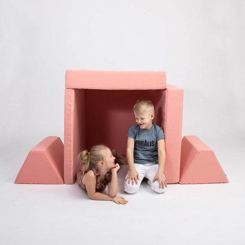 4. Two children playing inside a tent made from Monboxy salmon pink play mattress set with trapezoidal pillows