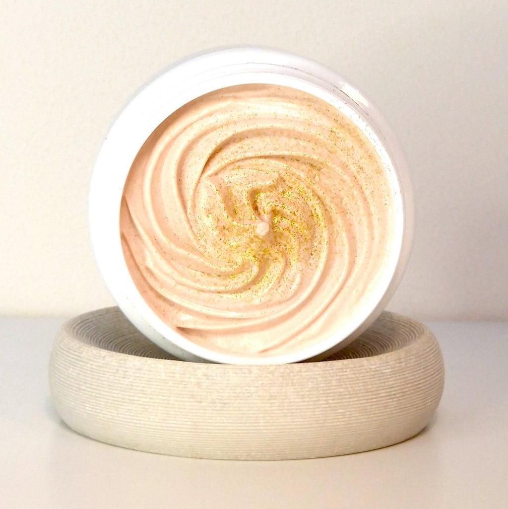 1. Open jar of North Beauty Golden Glow Body Cream Soufflé showing rich, swirled texture with shimmering particles