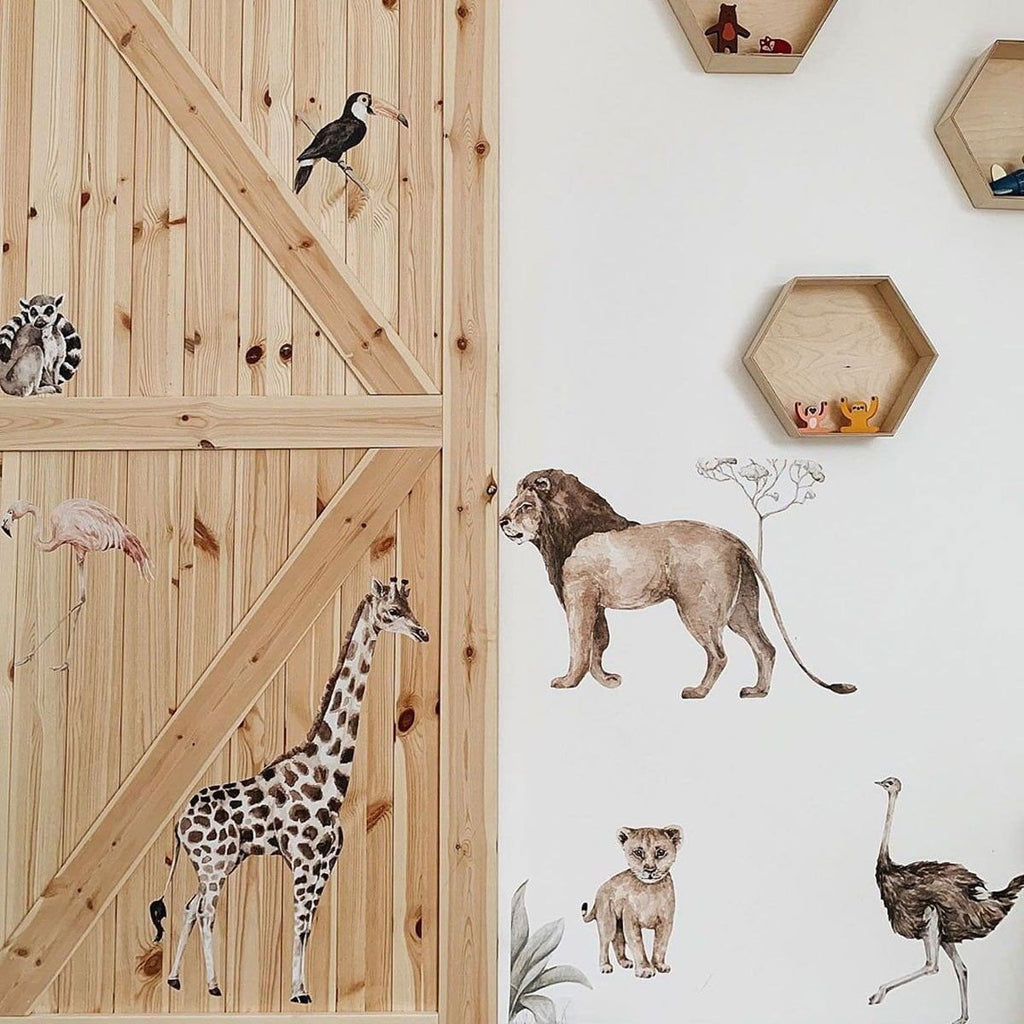 10. Savanna Wonderland wallstickers of giraffe, lion, and toucan on wooden wall in child's room
