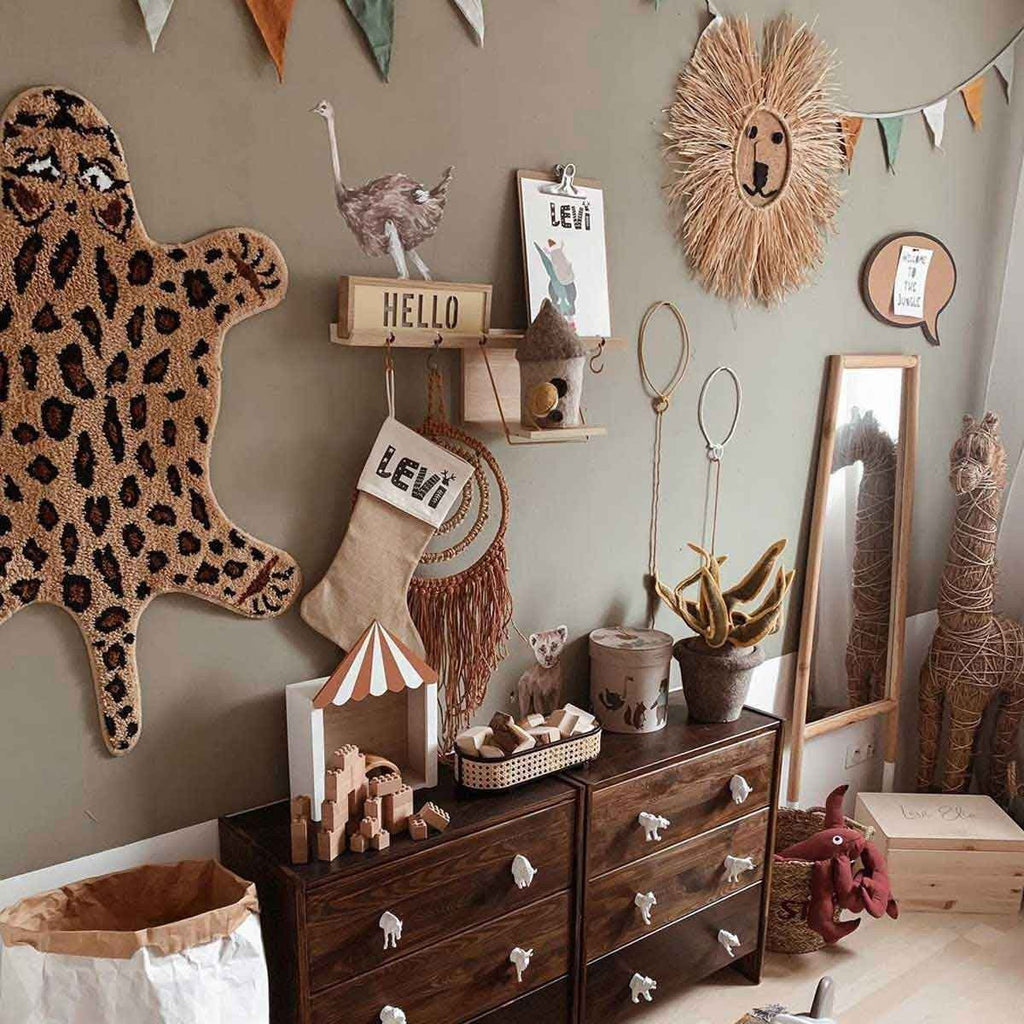 3. Children's room with Savanna Wonderland wallstickers, featuring ostrich and lion decor on wall above dresser