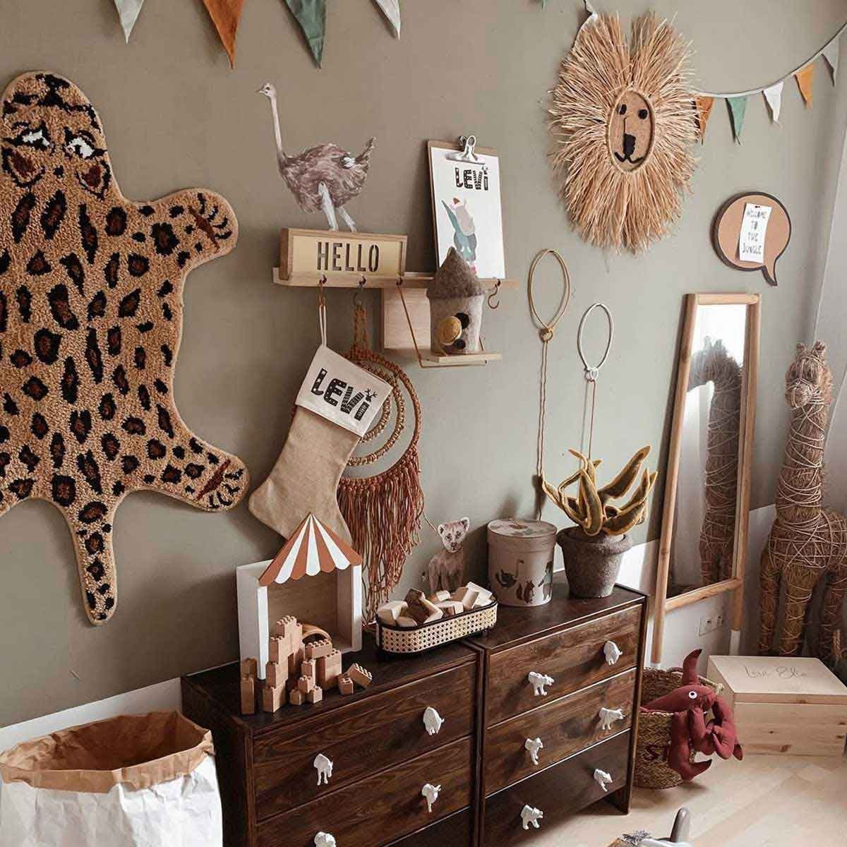 3. Children's room with Savanna Wonderland wallstickers, featuring ostrich and lion decor on wall above dresser
