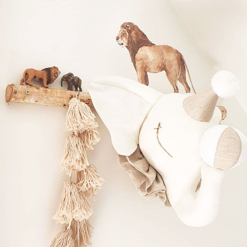 8. Savanna Wonderland wallstickers of lion and elephant on wall with decorative tassels