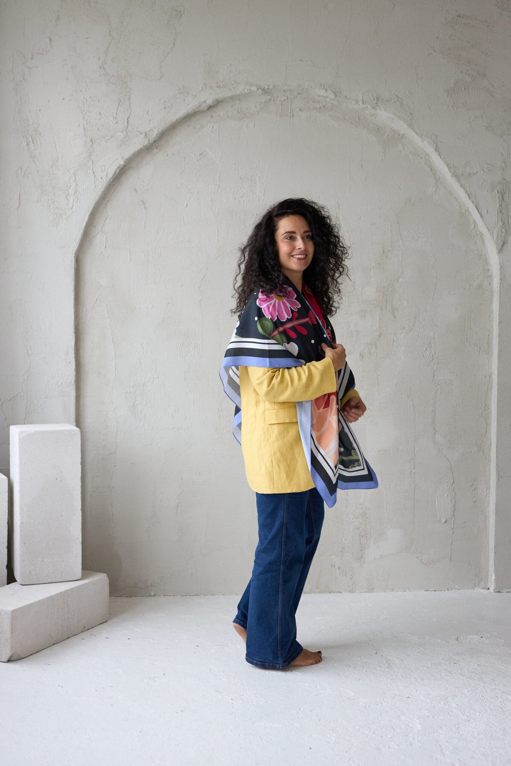 5. Woman wearing Garbanota Scarf Curly Summer Night, shown from side in studio