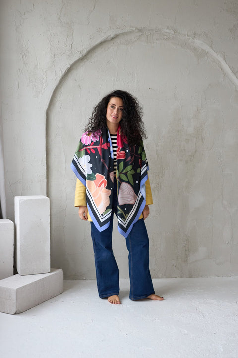 1. Woman wearing Garbanota Scarf Curly Summer Night in studio, styled as a shawl