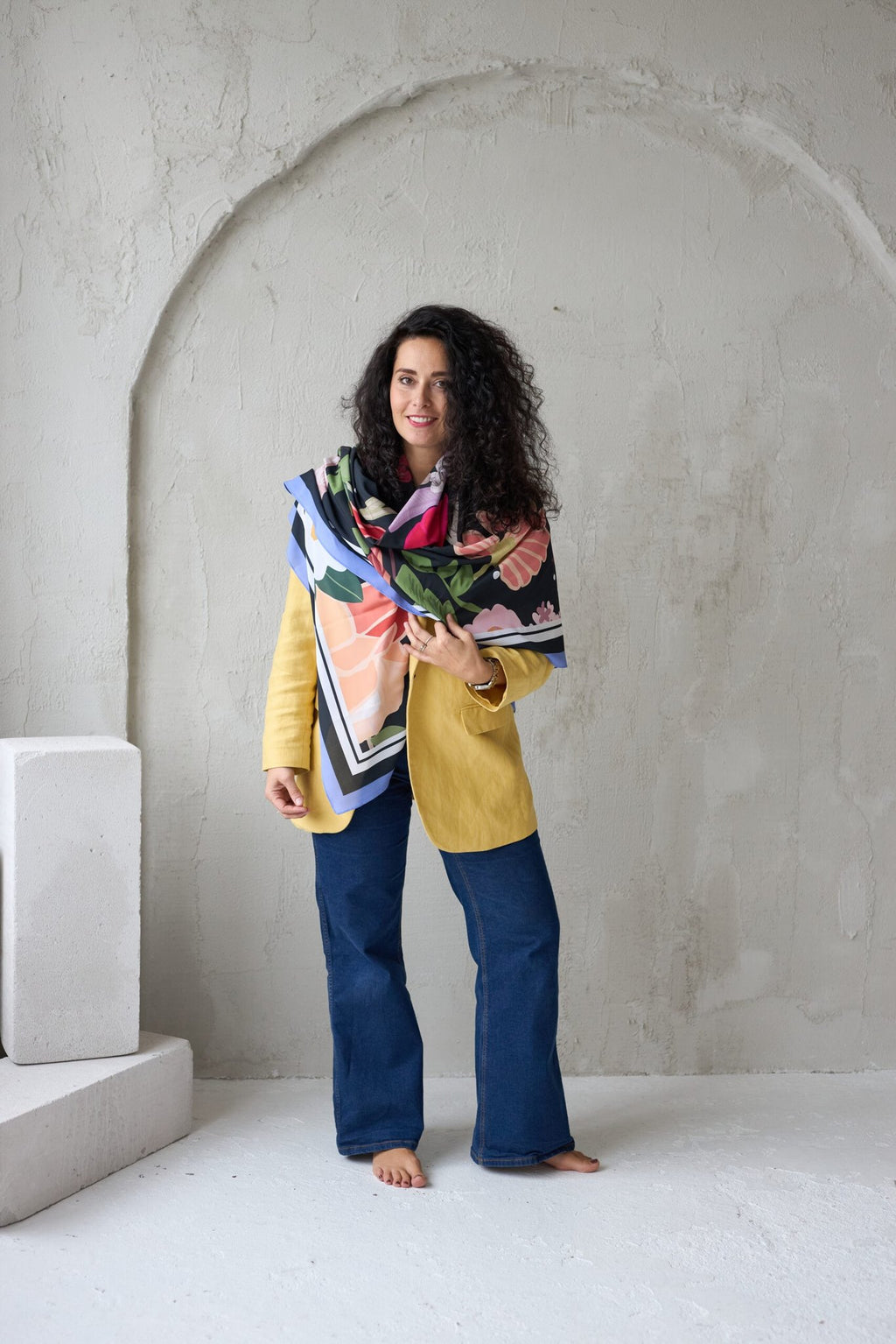 2. Woman wearing Garbanota Scarf Curly Summer Night, draped around shoulders in studio