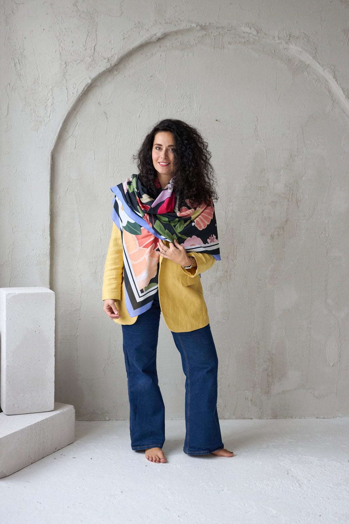 2. Woman wearing Garbanota Scarf Curly Summer Night, draped around shoulders in studio