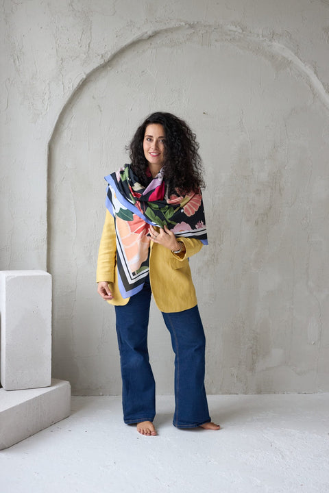 2. Woman wearing Garbanota Scarf Curly Summer Night, draped around shoulders in studio