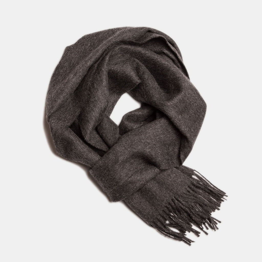 18. Dark brown Alpaka baby alpaca wool scarf with fringe detail in flat lay