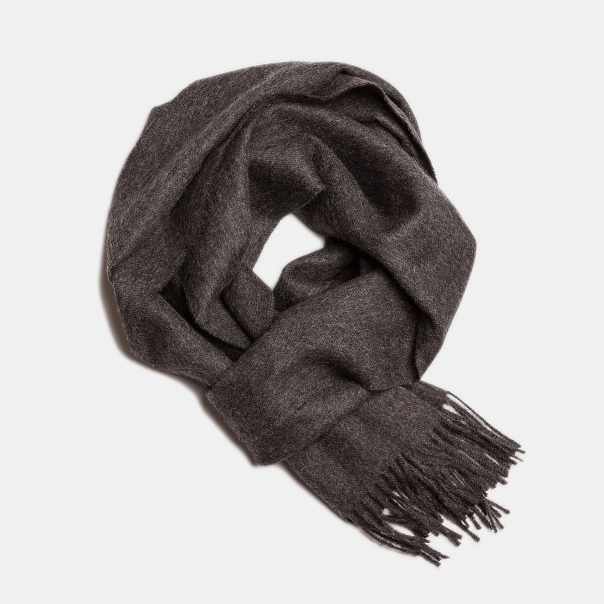 18. Dark brown Alpaka baby alpaca wool scarf with fringe detail in flat lay