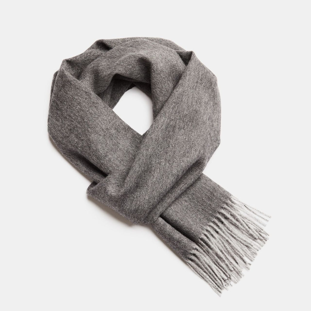 24. Studio image of Alpaka natural baby alpaca wool scarf in dark grey with fringe detail